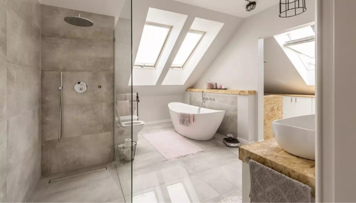 Phối cảnh phòng tắm hiện đại, ngập tràn ánh sáng tự nhiên với thiết kế tối giản, sử dụng gam màu trung tính và vật liệu gạch lát vân xi măng tạo cảm giác rộng rãi,